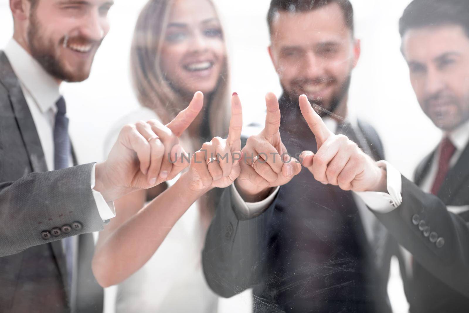 business team pointing to a virtual point by asdf