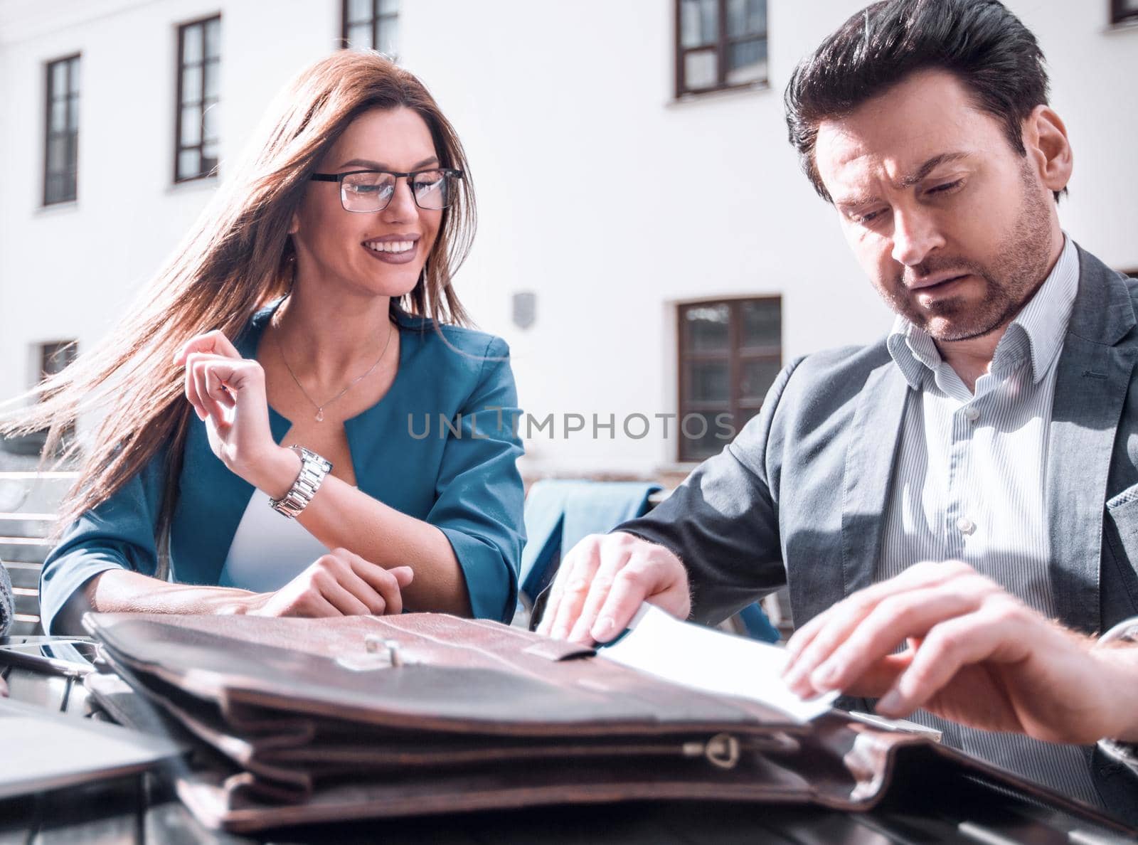 close up.business partners sit at a table on the street,