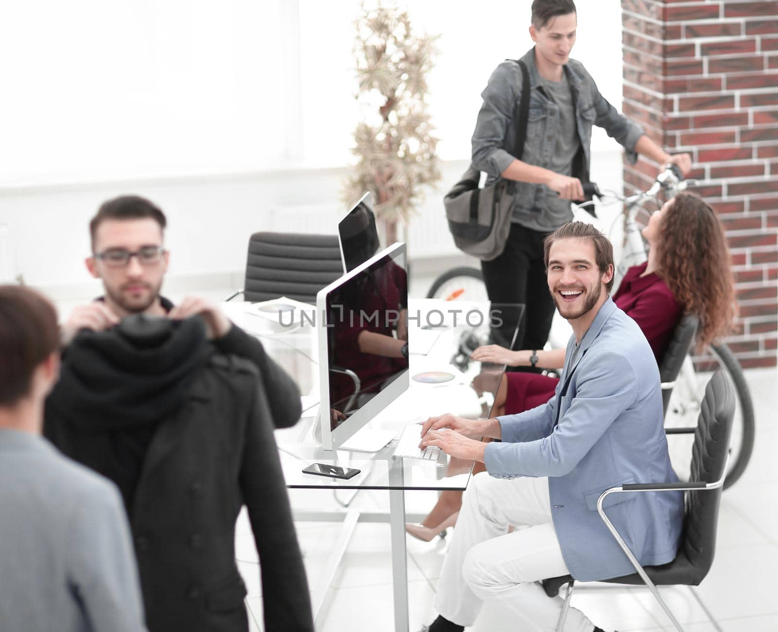 group of designers and tailors working in the Studio .photo with copy space.