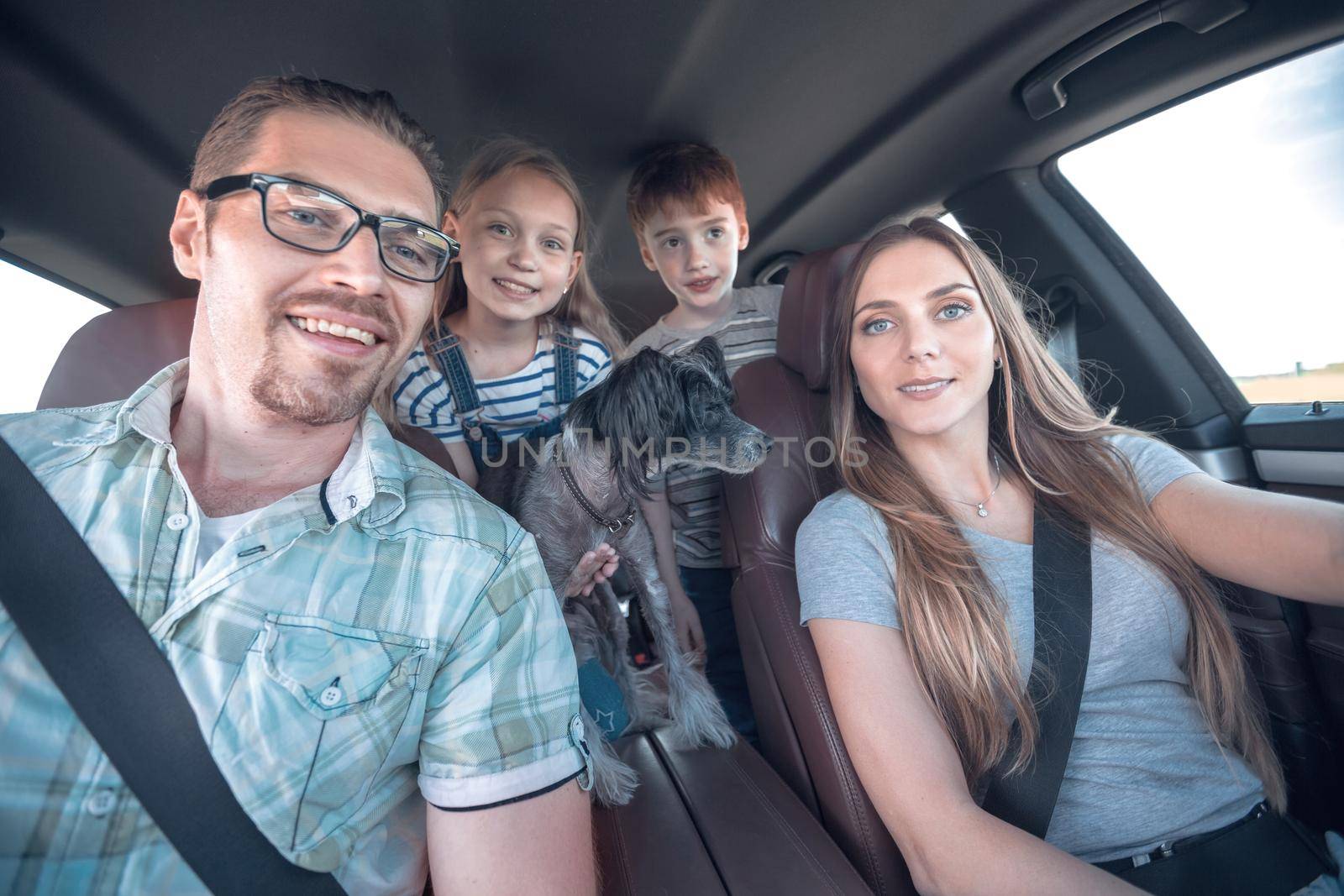 close up. happy family in a comfortable car by asdf