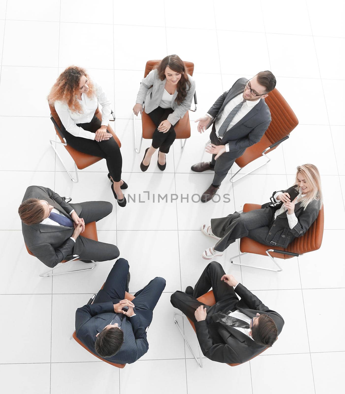 view from the top.successful business team sitting in a circle and looking at the camera.