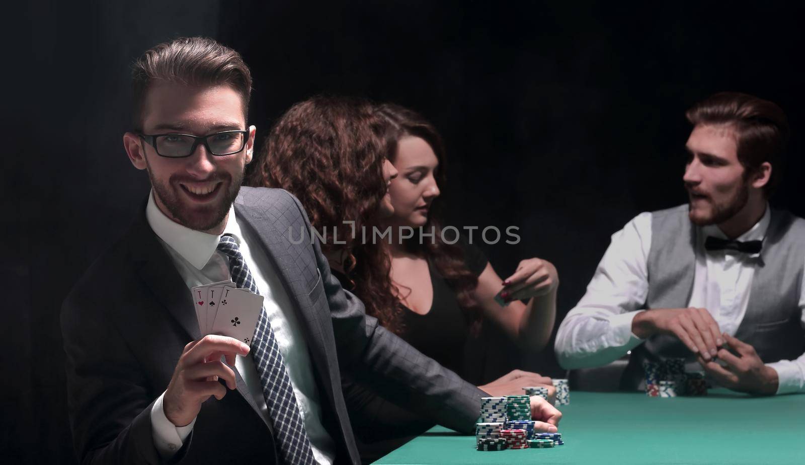 background image. game of poker. players sitting at a green gaming table
