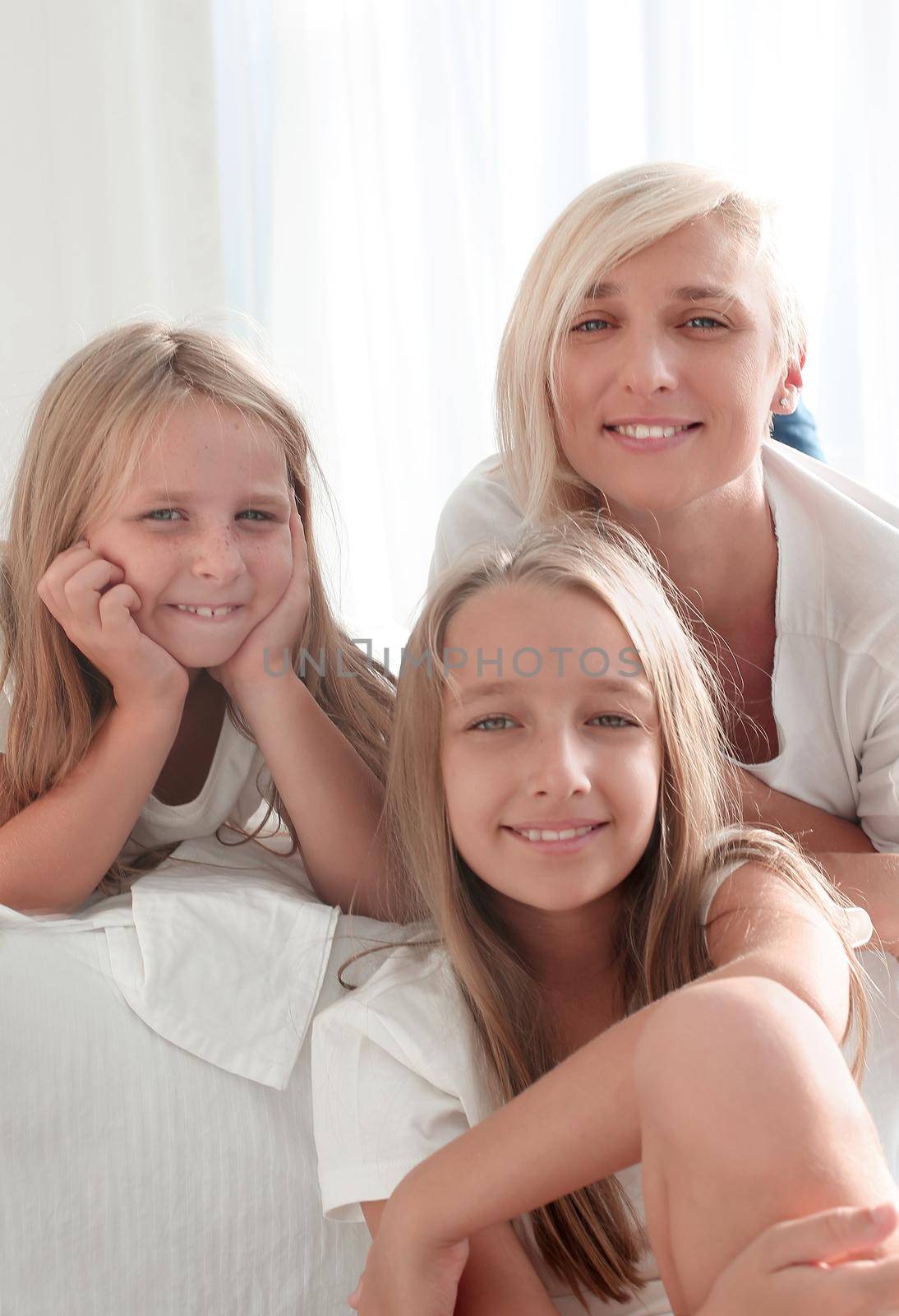 portrait of a mother with two small daughters by asdf