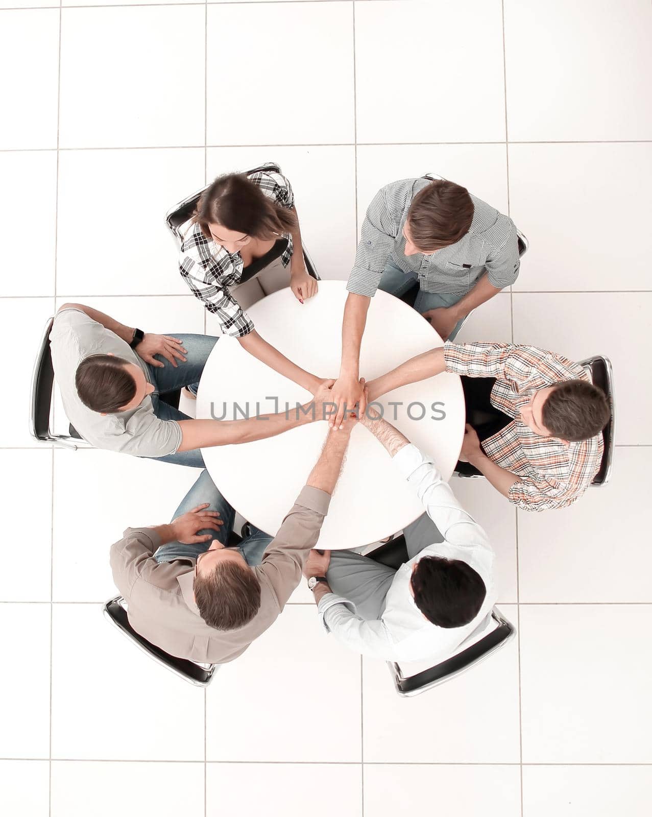 top view.single business team sitting at the round table .photo with copy space