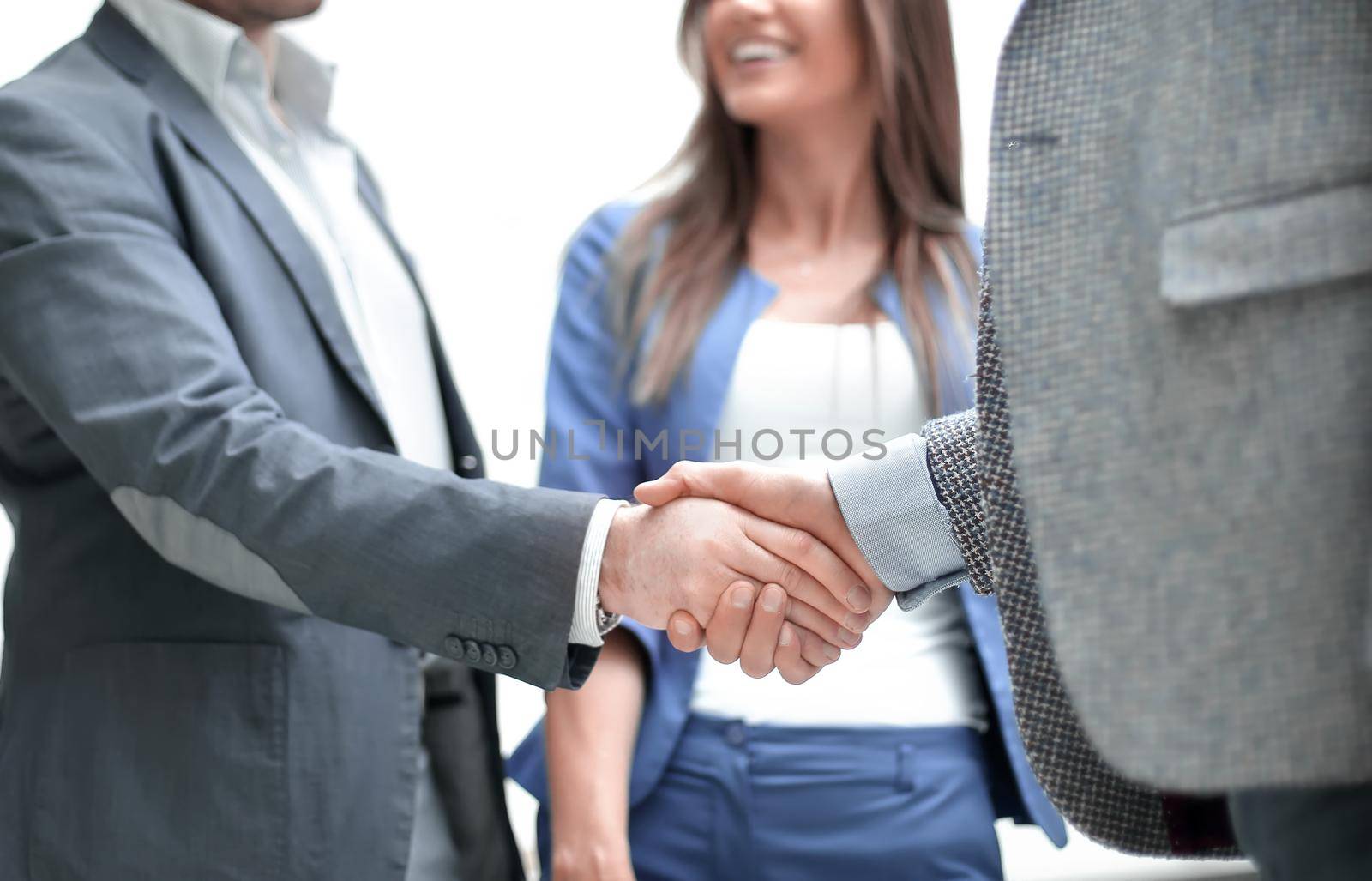 business people greet each other with a handshake by asdf