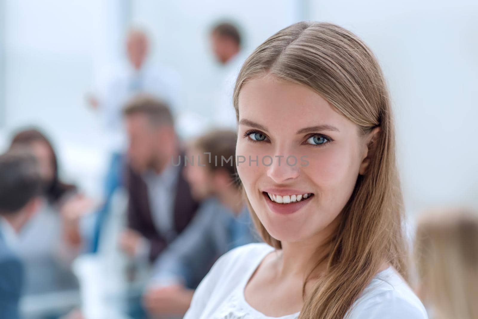 portrait of a successful young woman on the background of the office by asdf