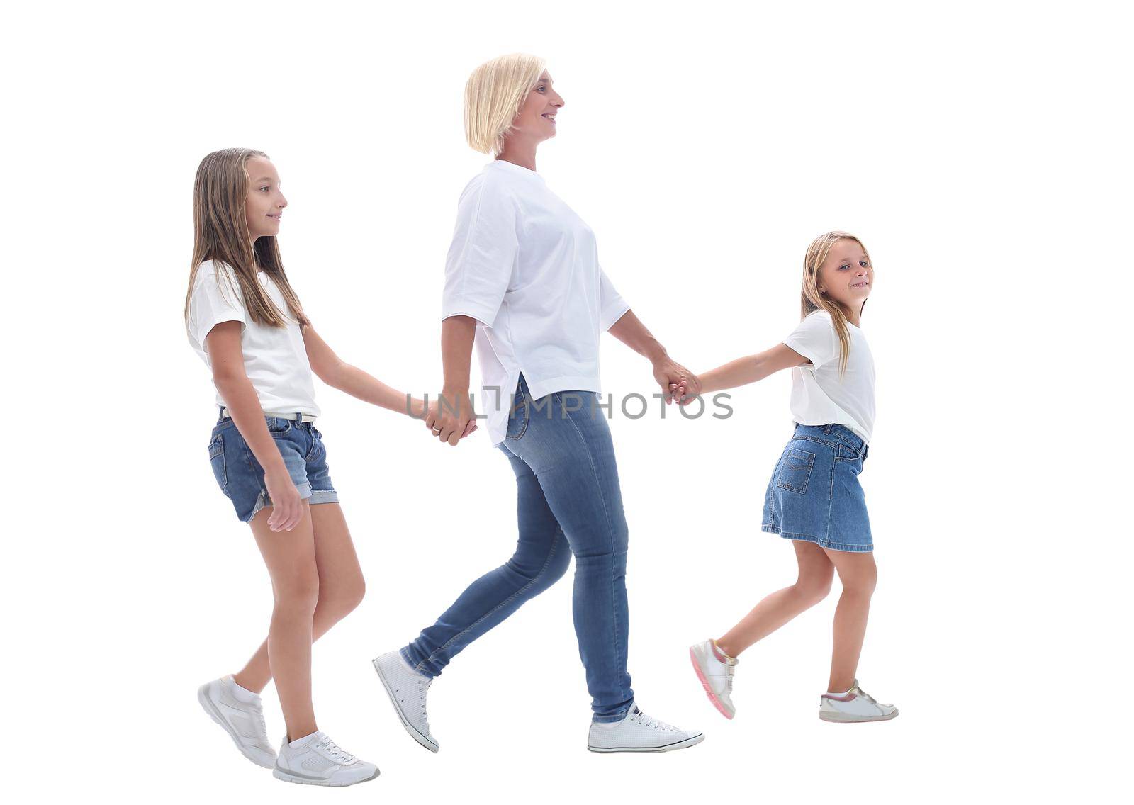 side view . mom and daughters going together. isolated on white background