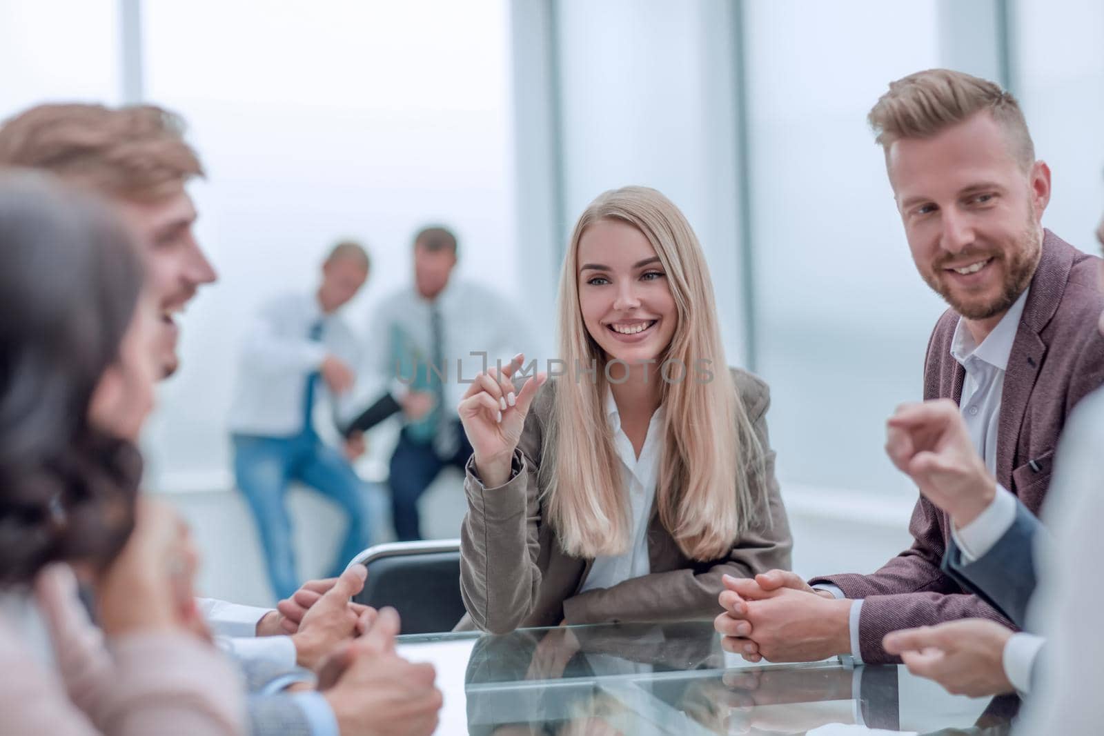 young business woman discusses her ideas with a business team. the concept of teamwork