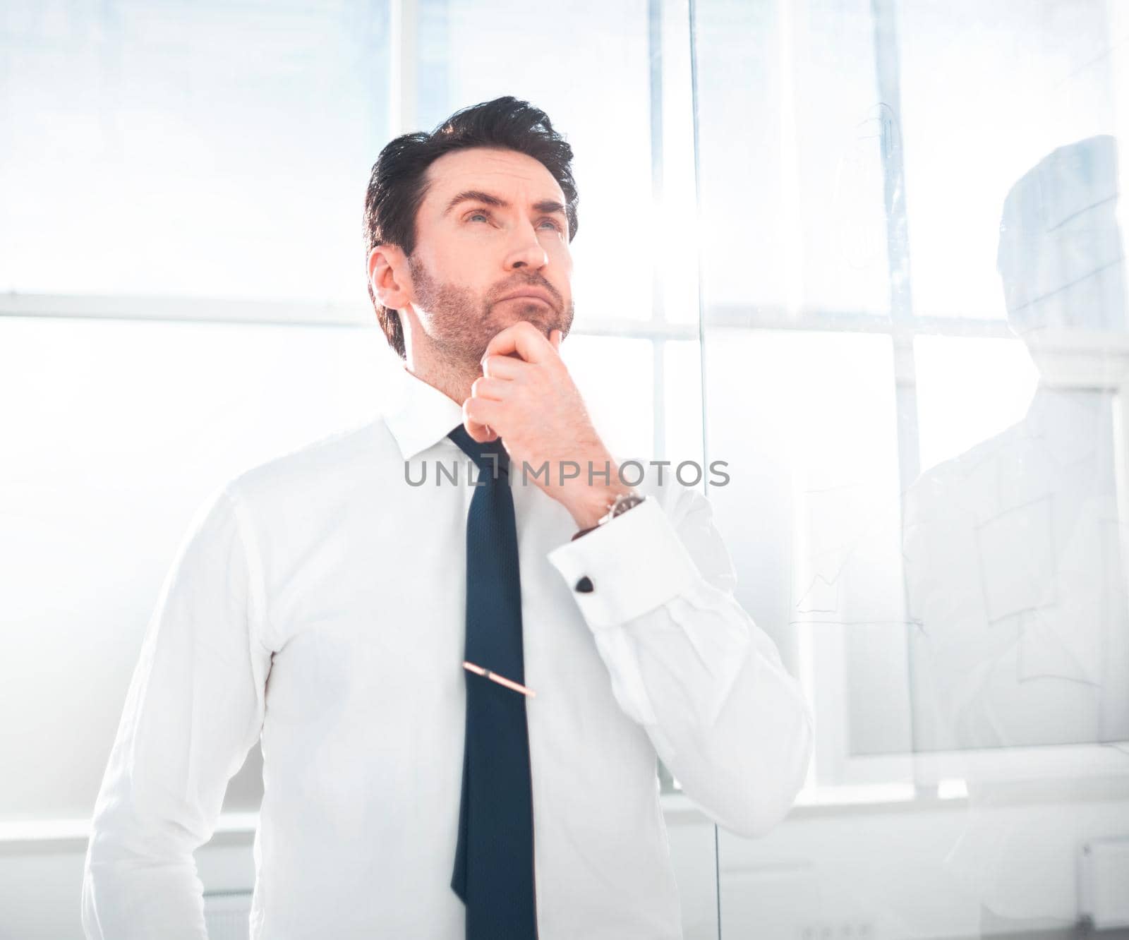 dreaming businessman standing in the office.business concept
