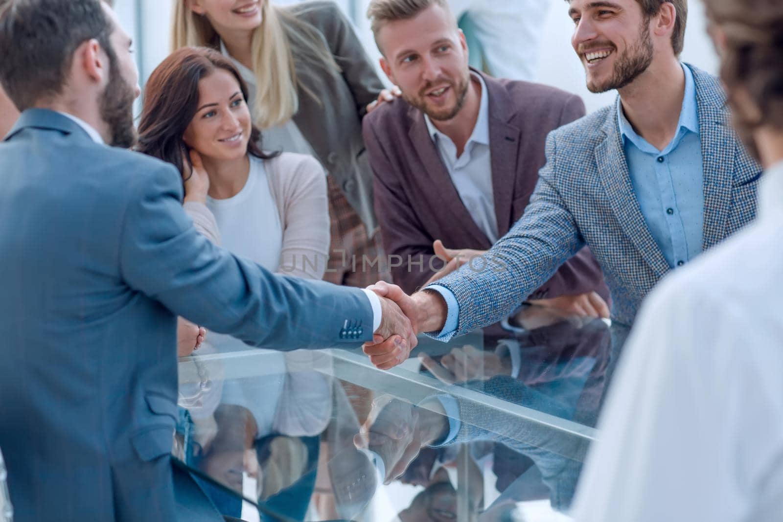 business people greet each other with a handshake by asdf