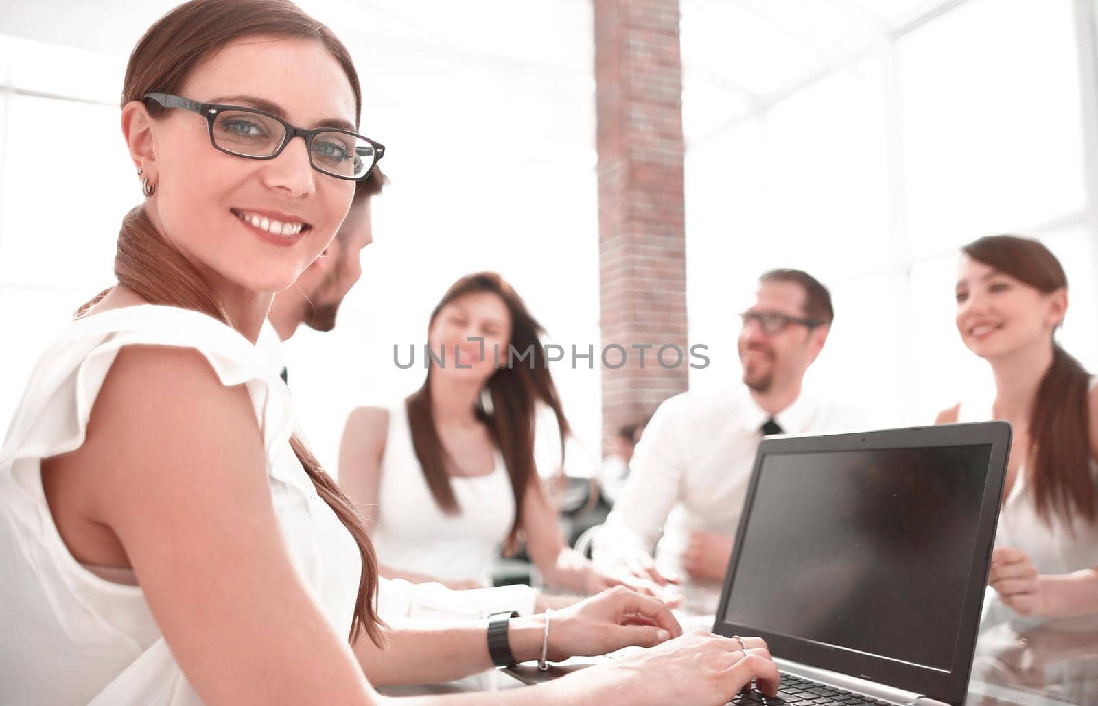 young business woman working on laptop by asdf