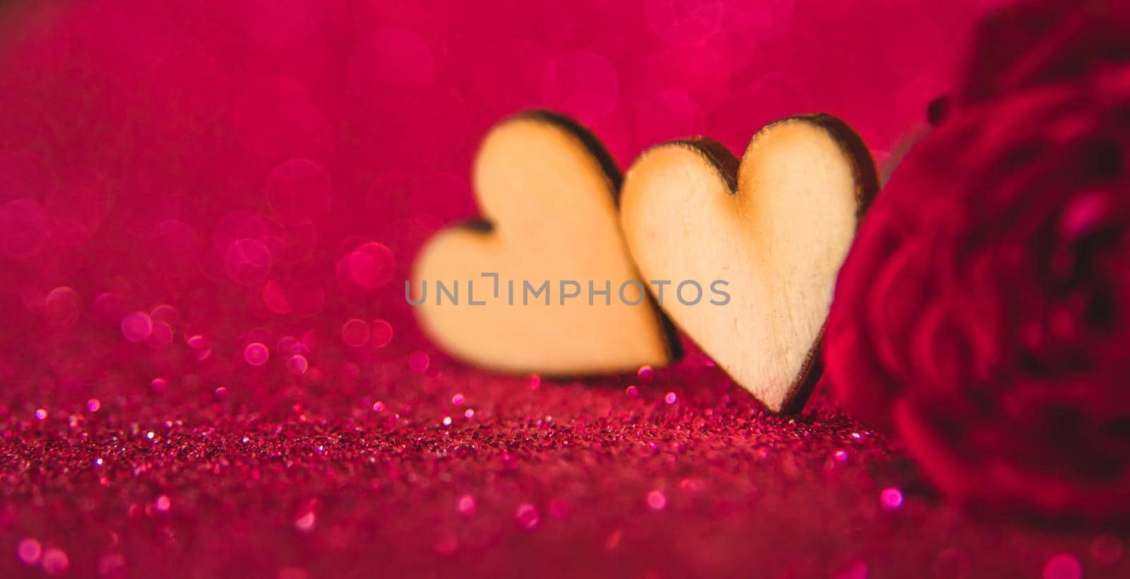 Shiny background with valentine heart. Selective focus. by yanadjana