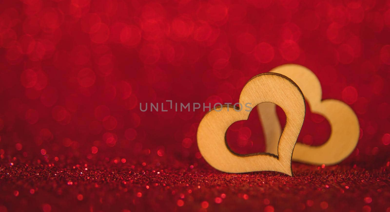 Shiny background with valentine heart. Selective focus. by yanadjana