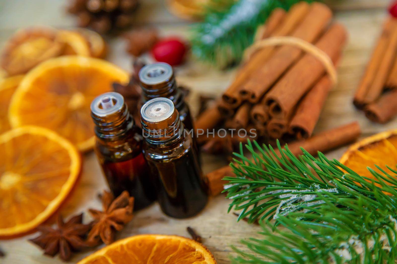 Christmas essential oils in small bottles. Selective focus. by yanadjana