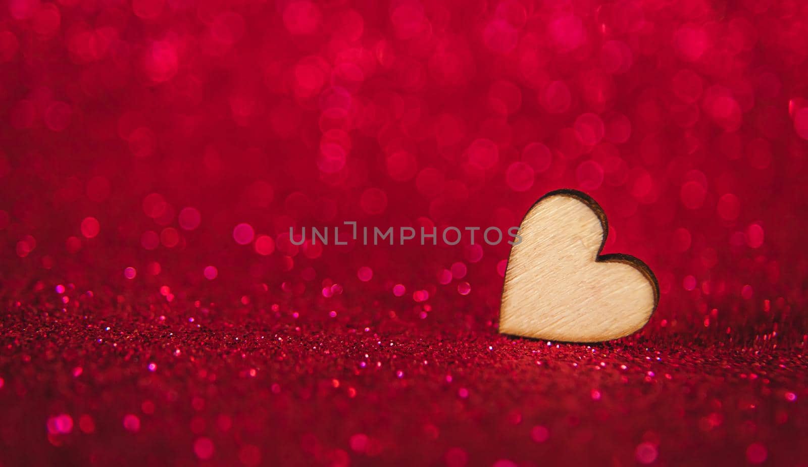 Shiny background with valentine heart. Selective focus. by yanadjana