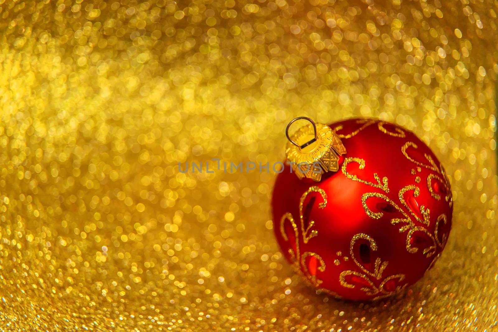 Christmas tree decorations on a shiny background. Vibratory focus. by yanadjana