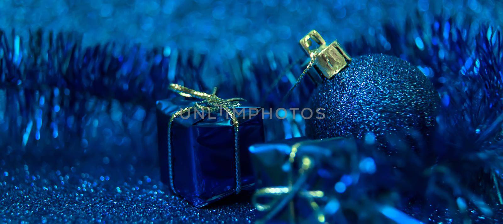 Christmas tree decorations on a shiny background. Vibratory focus. by yanadjana