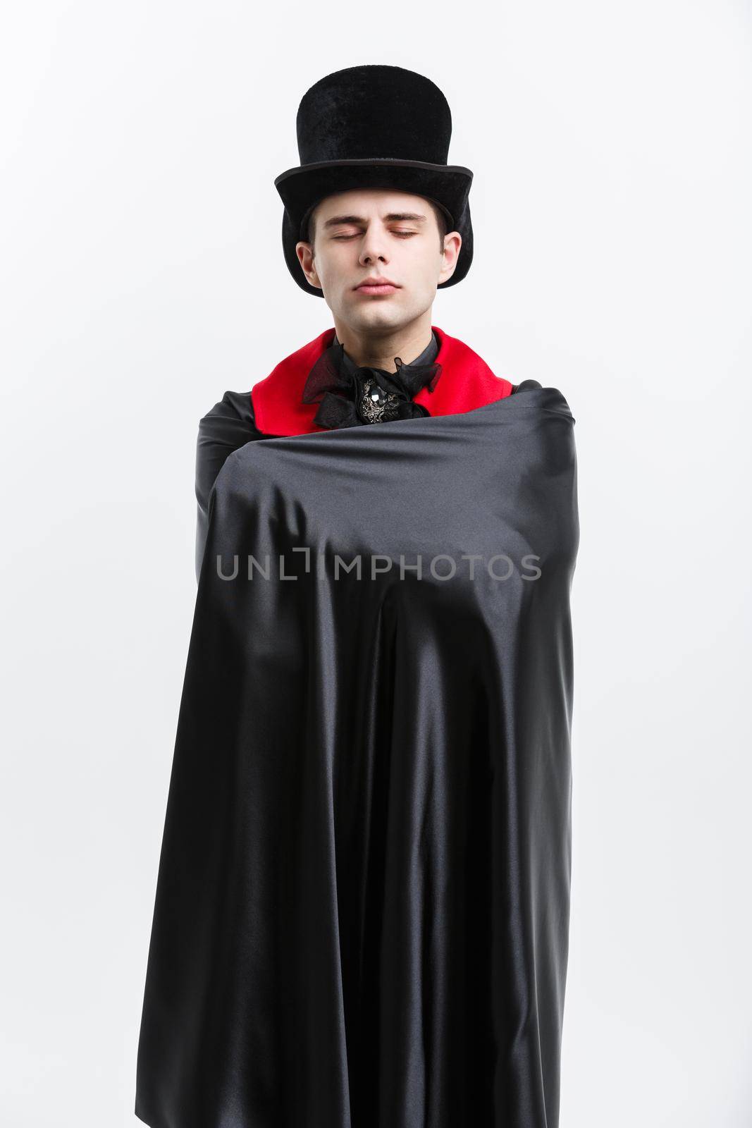 Vampire Halloween Concept - Portrait of caucasian vampire sleeping in halloween dracula costume