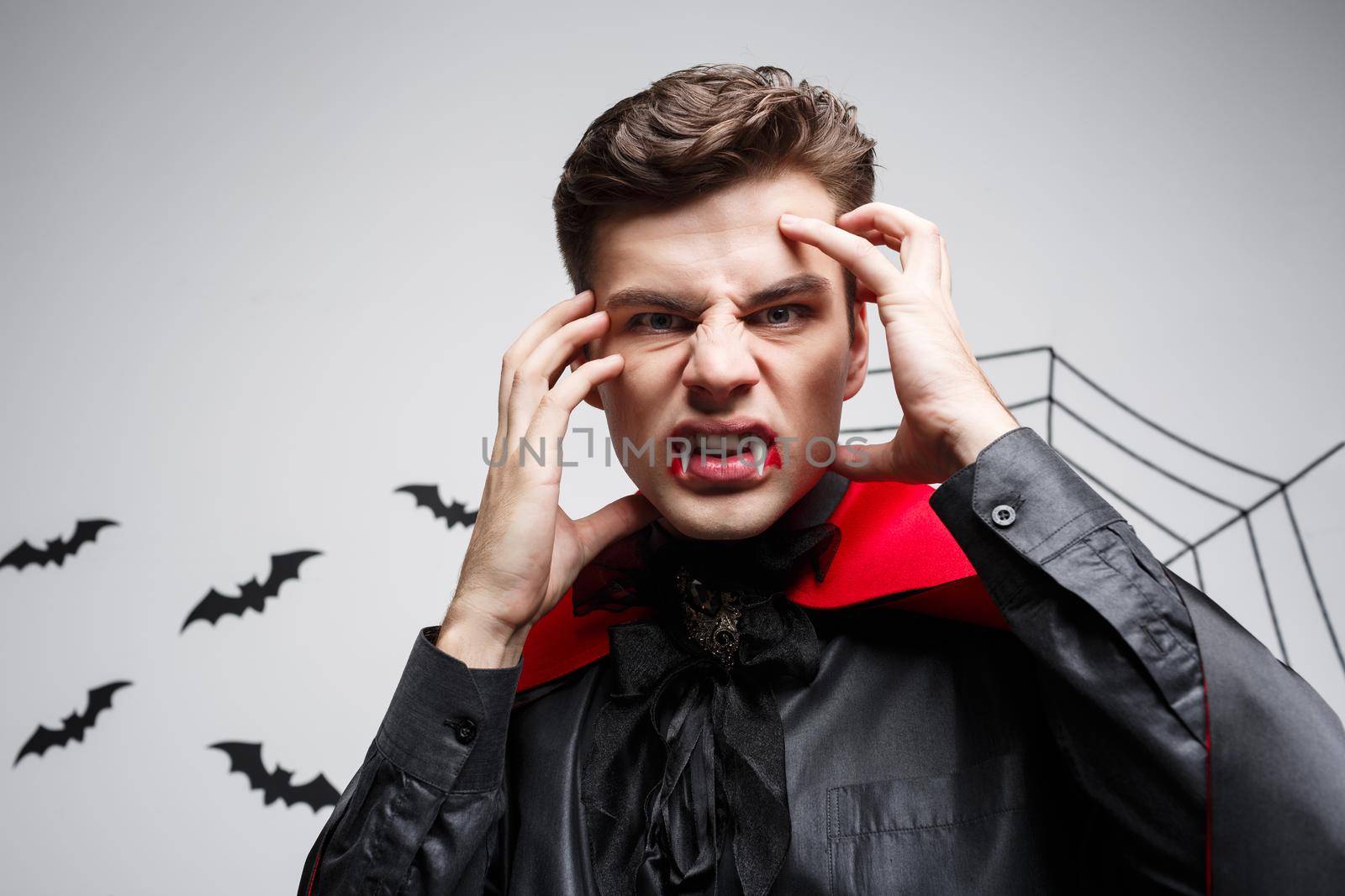 Vampire Halloween Concept - Portrait of Angry caucasian vampire screaming