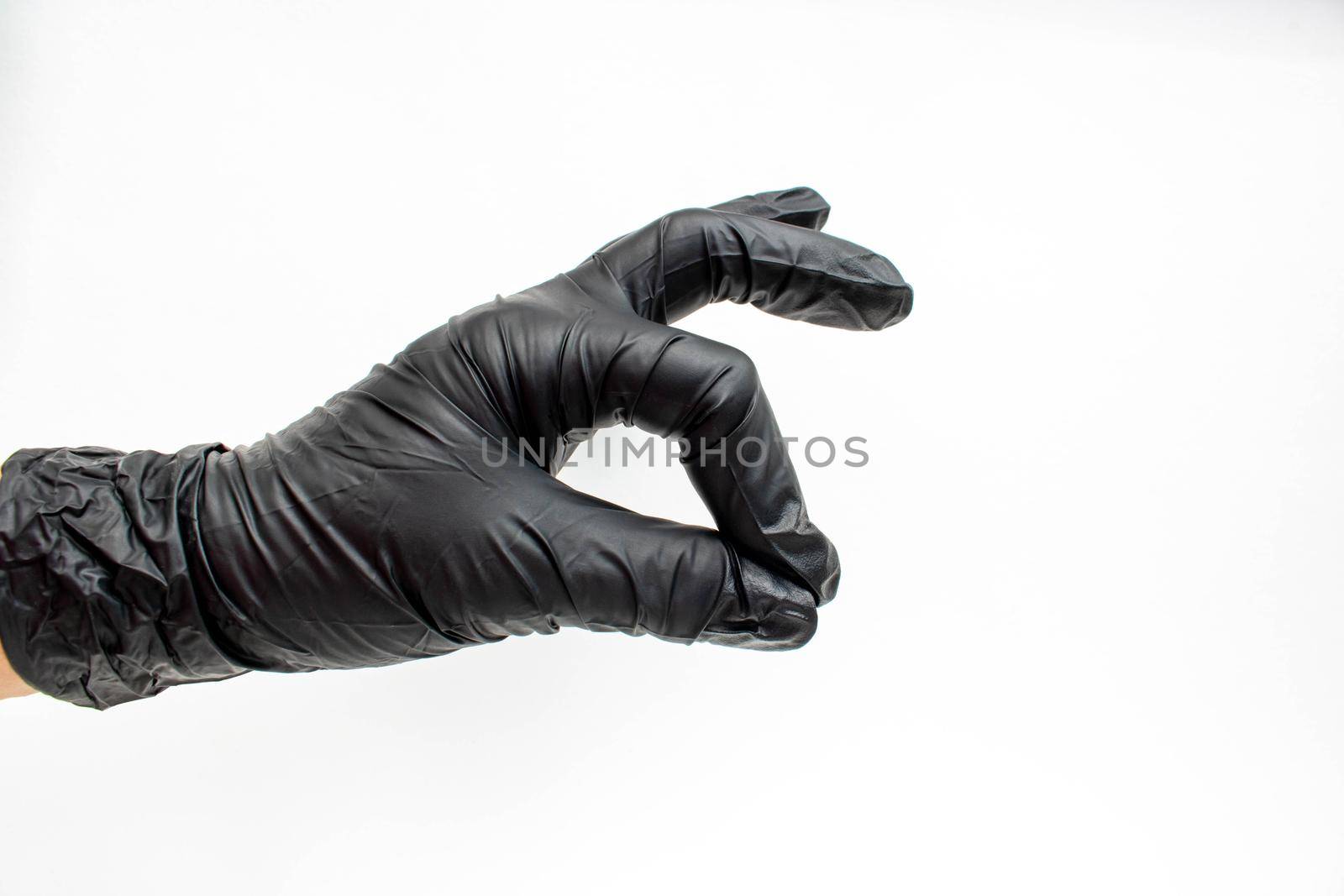 Hand in black gloves, protection. The concept of cleanliness.