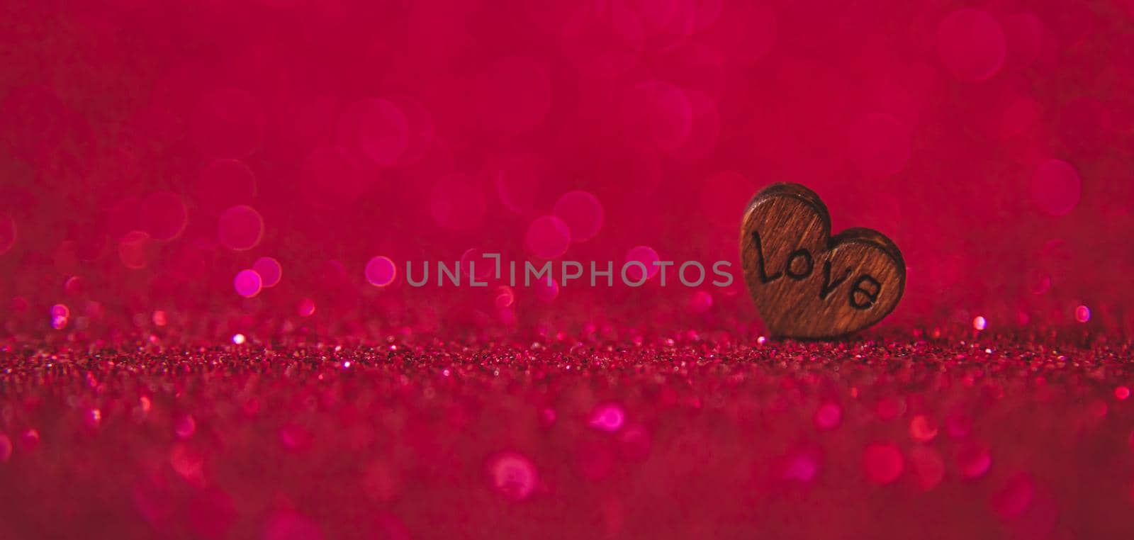 Shiny background with valentine heart. Selective focus. Love.