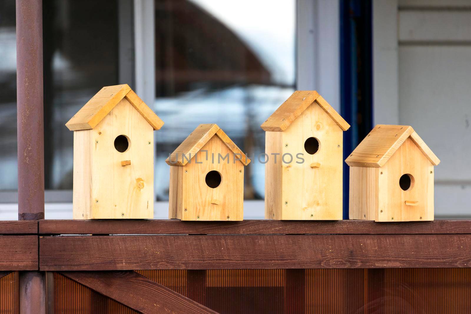 Four wooden birdhouses on sale by Nobilior