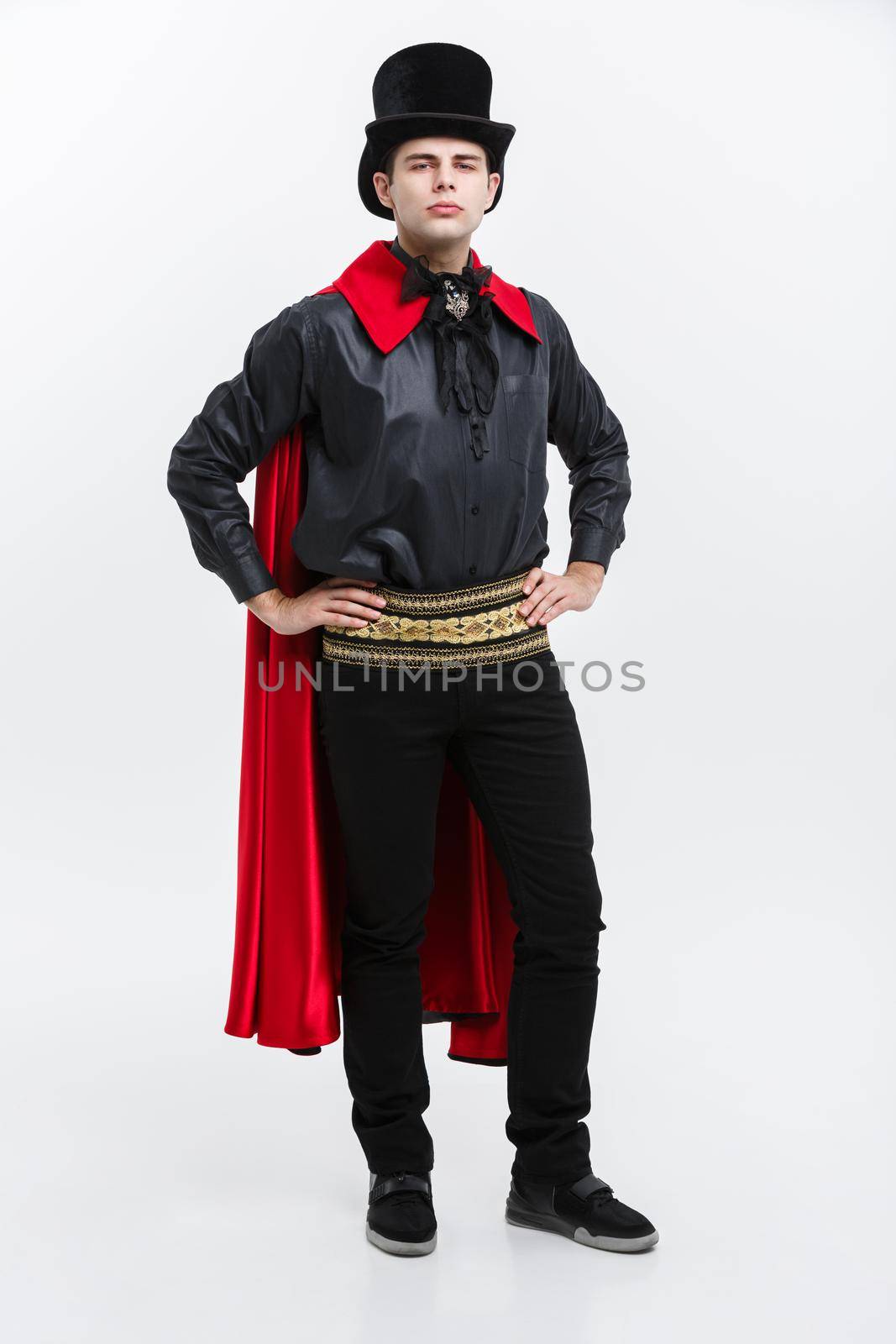 Vampire Halloween Concept - Full length Portrait of handsome caucasian Vampire in black and red halloween costume. by Benzoix