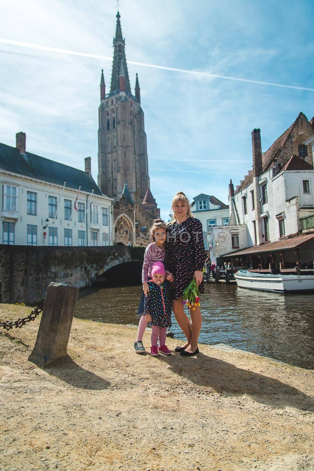 Bruges Belgium family on a walk. Selective focus. by yanadjana