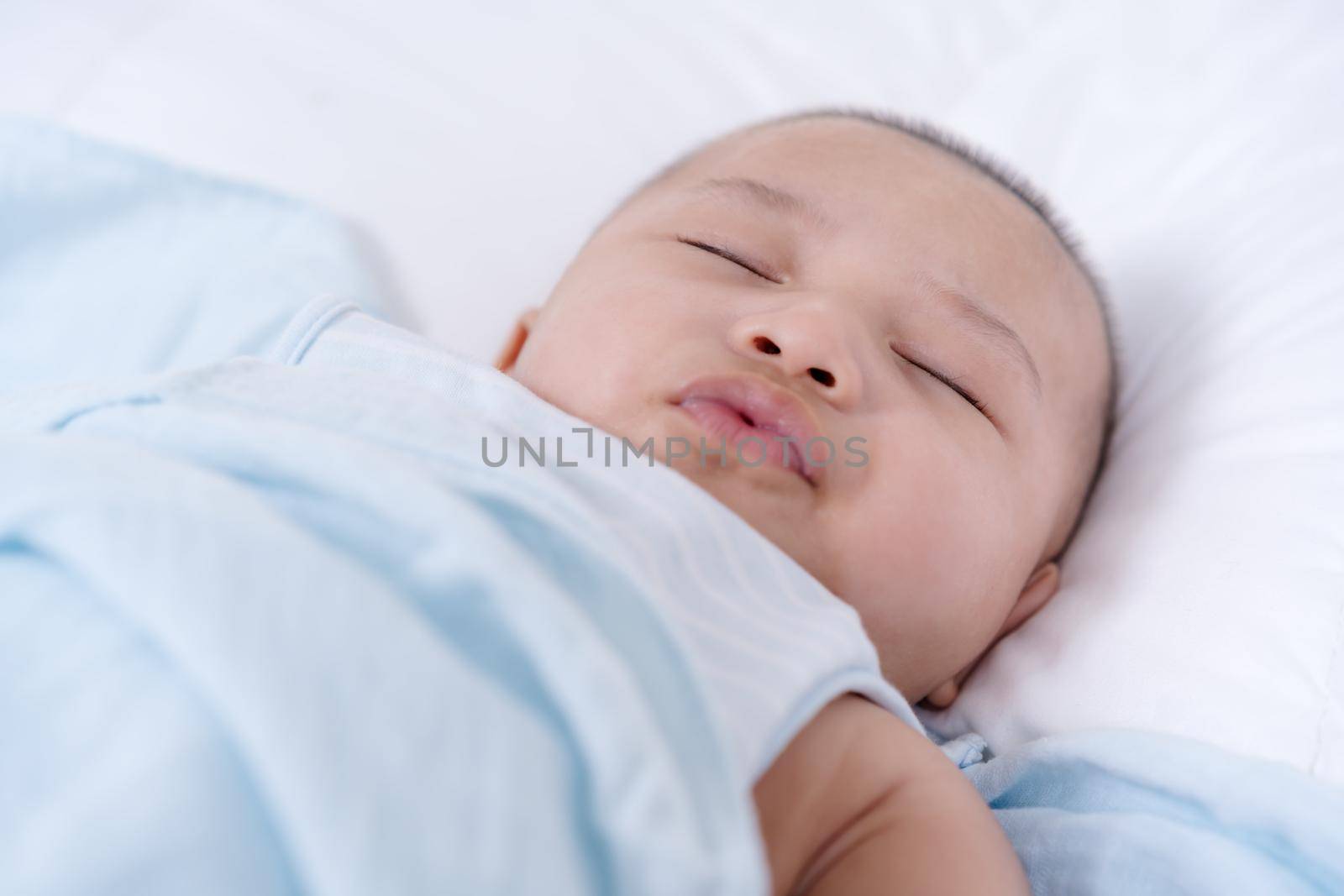 baby sleeping on a bed at home by geargodz