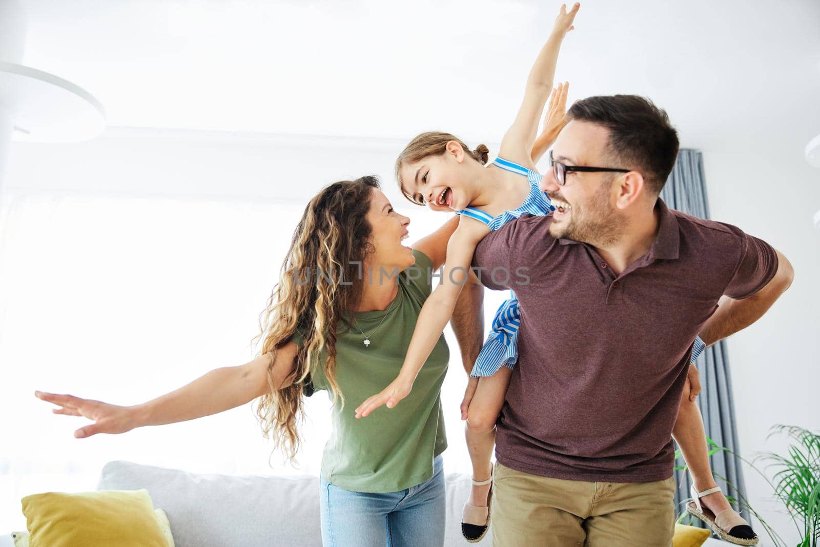 Family having fun playing at home