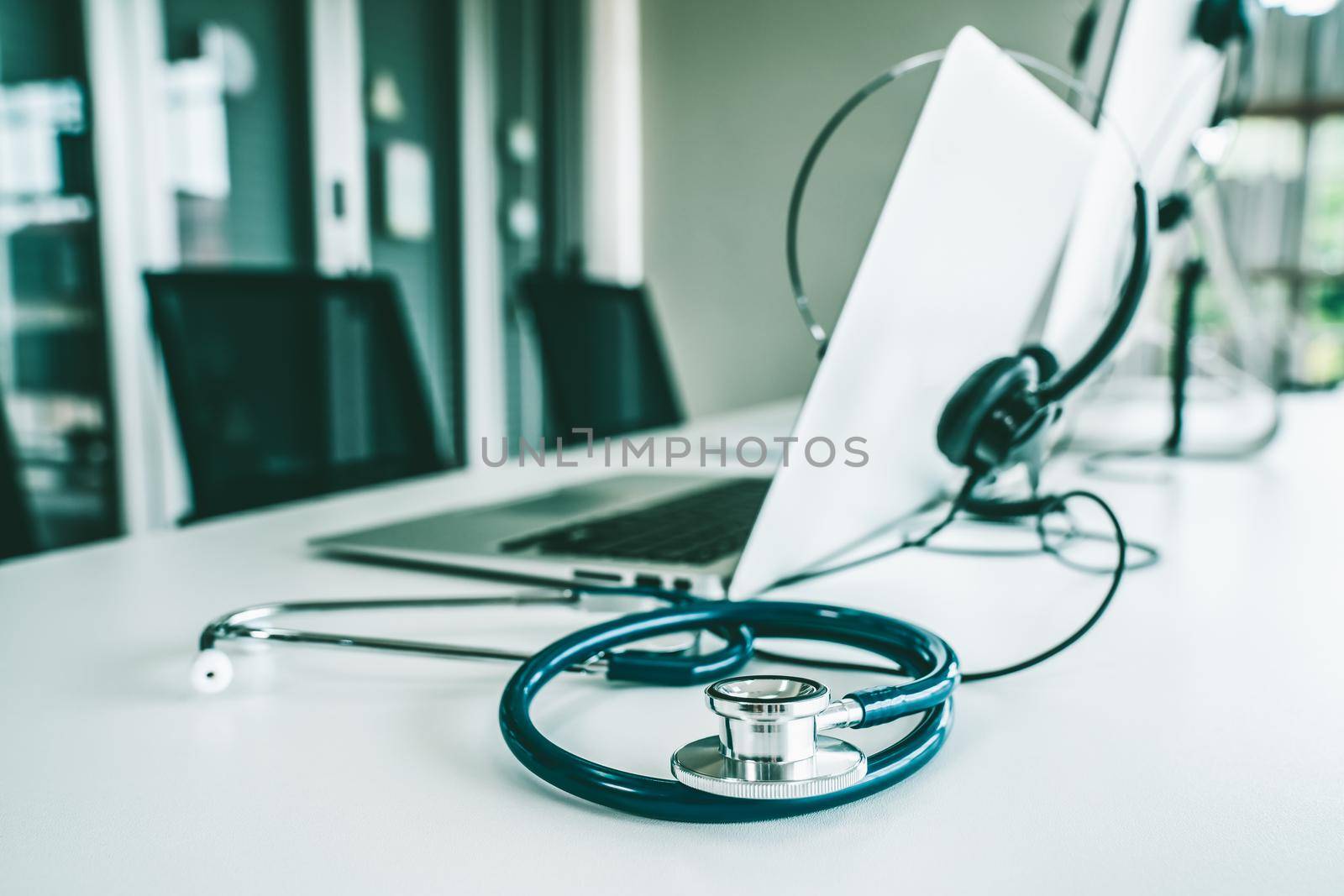 Headset and doctor equipment at clinic ready for actively support for patient by online video call . Concept of telehealth and telemedicine service .