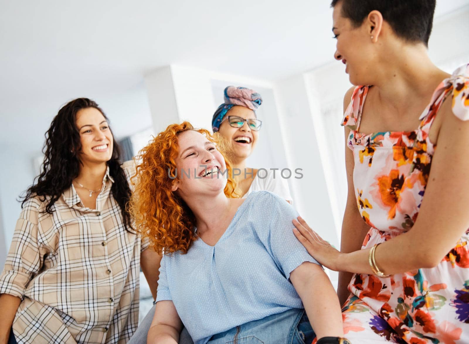 Portrait of a group of young happy women indoors or in start up office