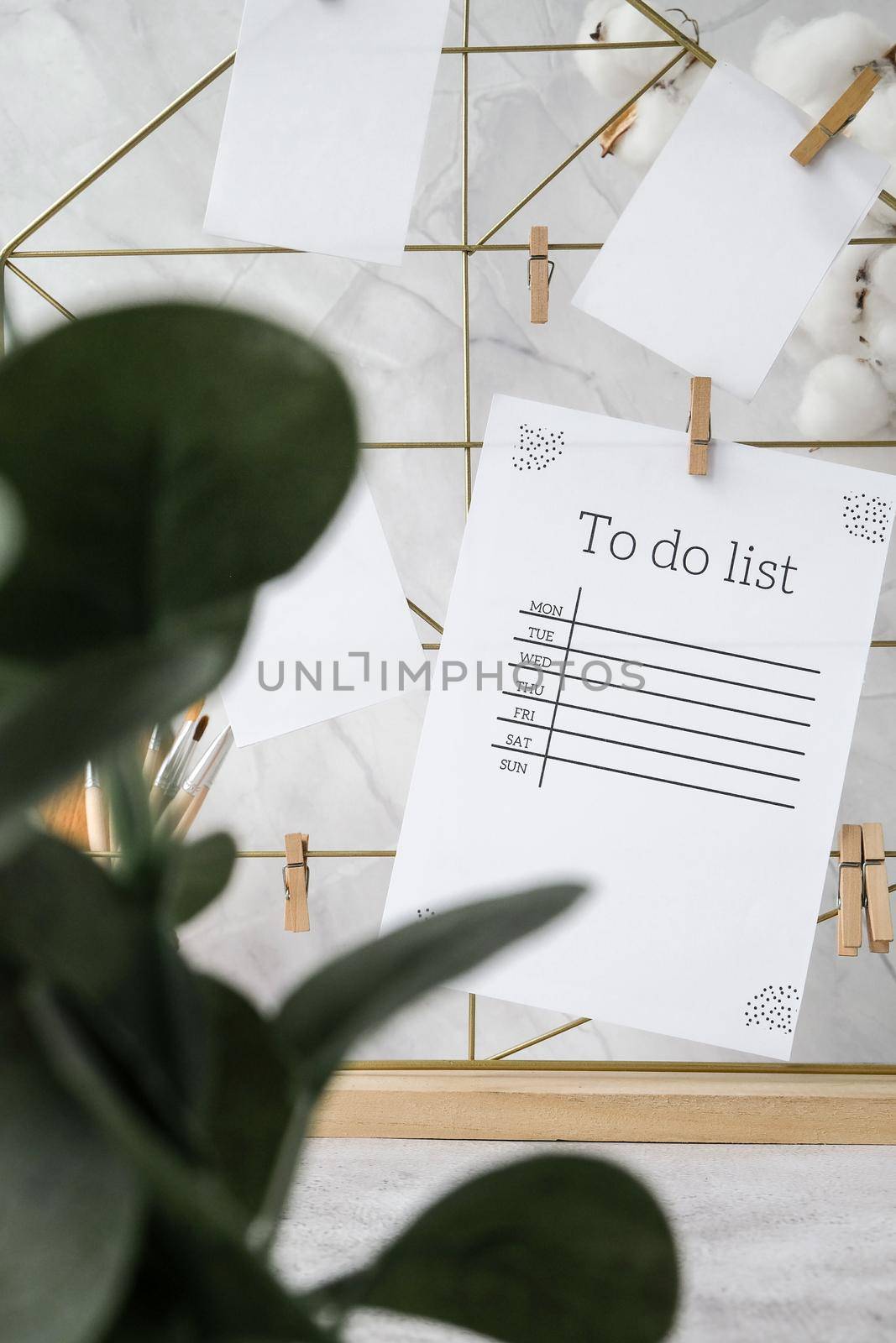 TO DO list Cards and posters mock ups on grid board. Copy space. Home office desktop. Freelance bloggers workplace. Brushes and palette tools Creative