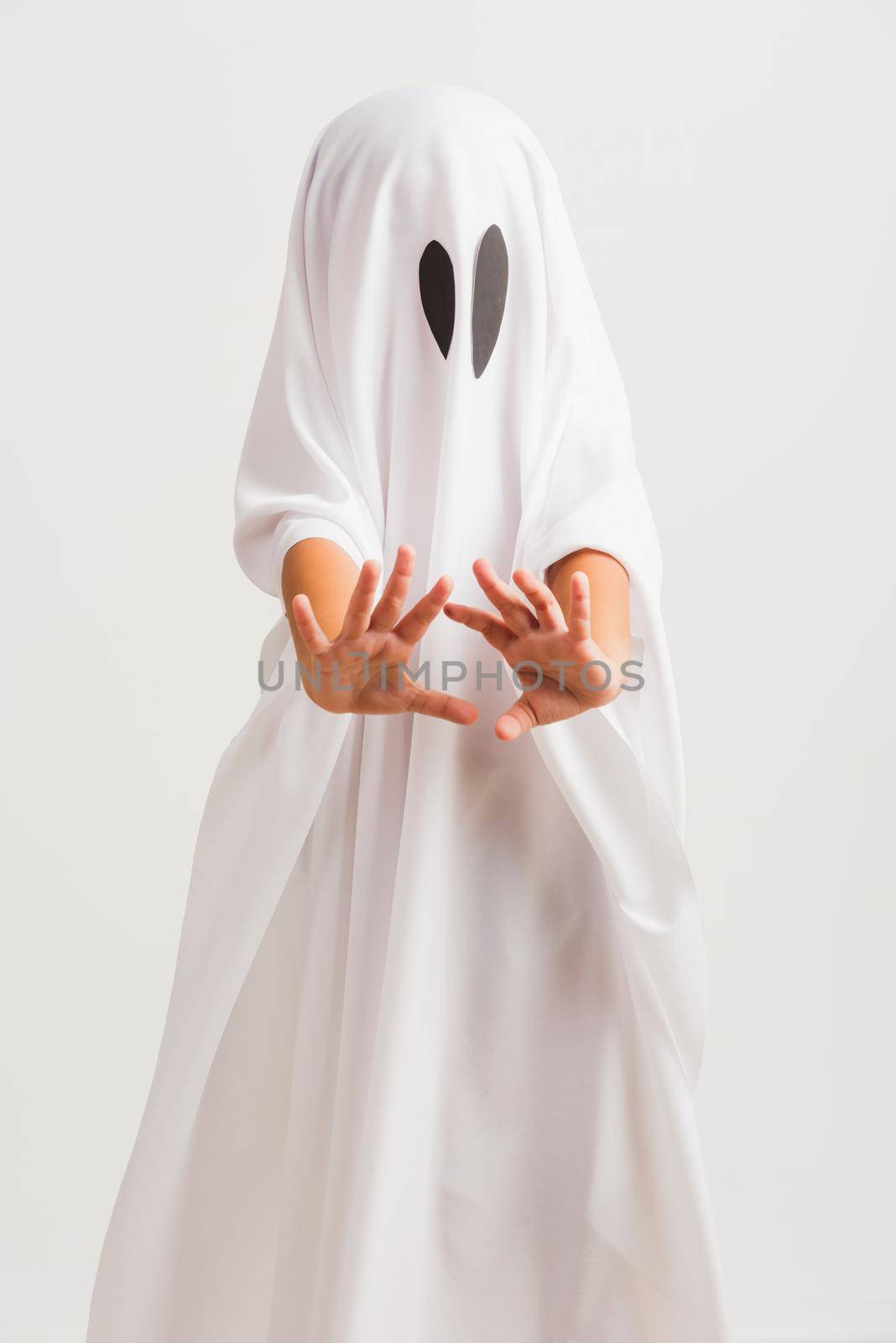 little cute child with white dressed costume halloween ghost scary by Sorapop