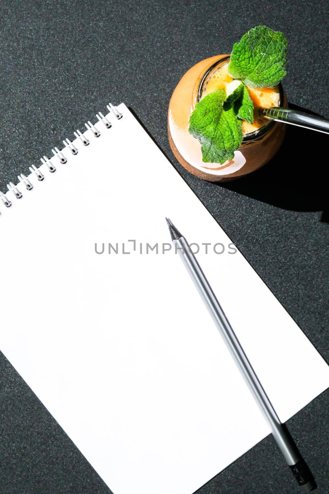 Seasonal pumpkin carrot smoothie drink detox with eco metal drinking straw. Glass bottle of orange smoothie. Paper note copy space. Clean eating, weight loss, healthy dieting food concept. Fruit vegetable drink fitness