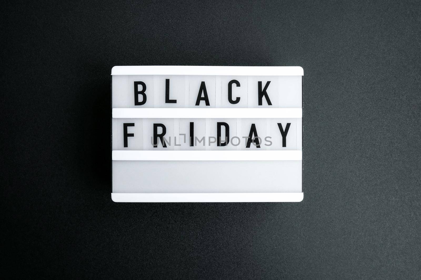 Lightbox with text BLACK FRIDAY on dark background, Sale shopping concept. Online shopping Big sale. Cyber monday