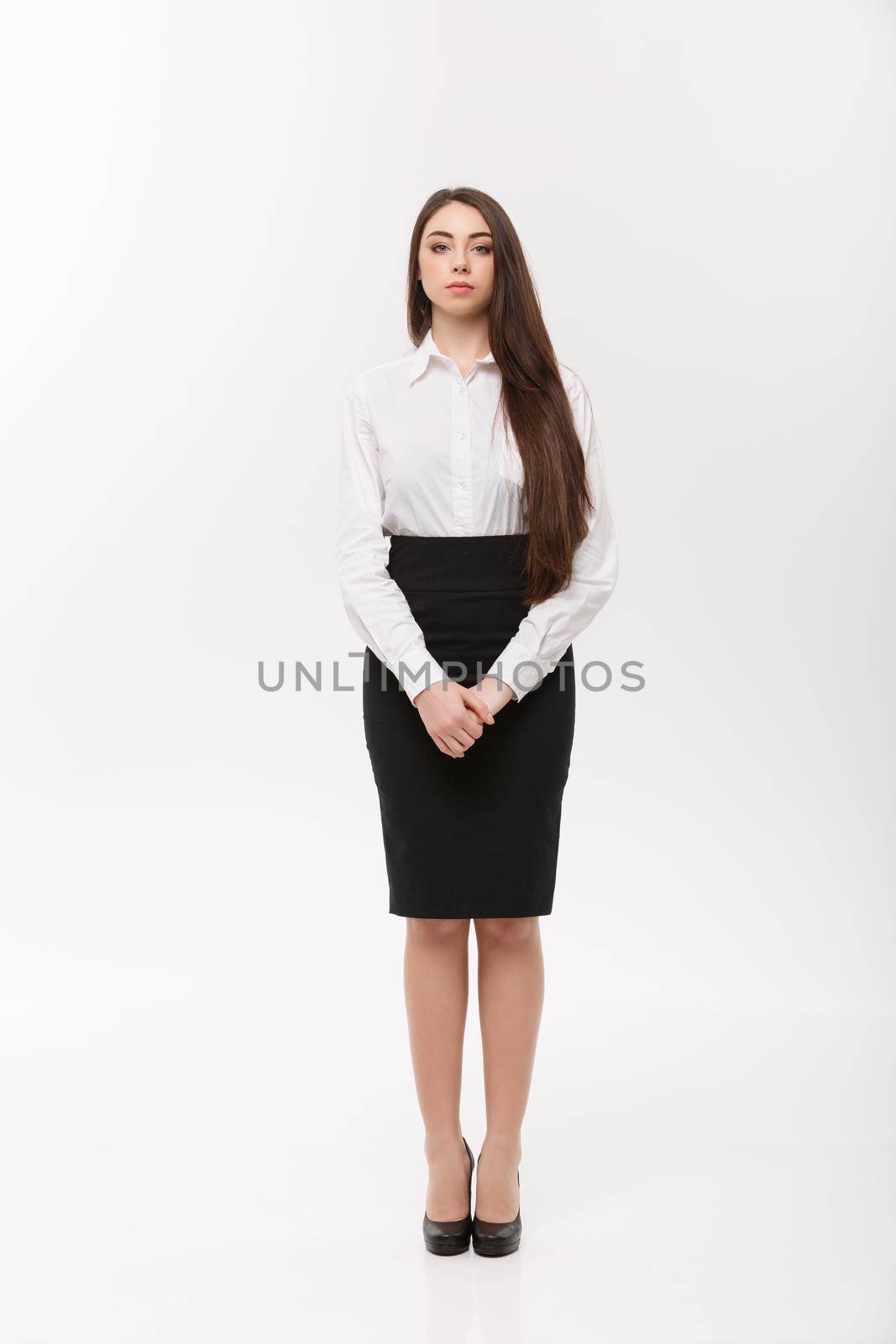 Business Concept - Modern caucasian business woman in the white studio background with copy space.