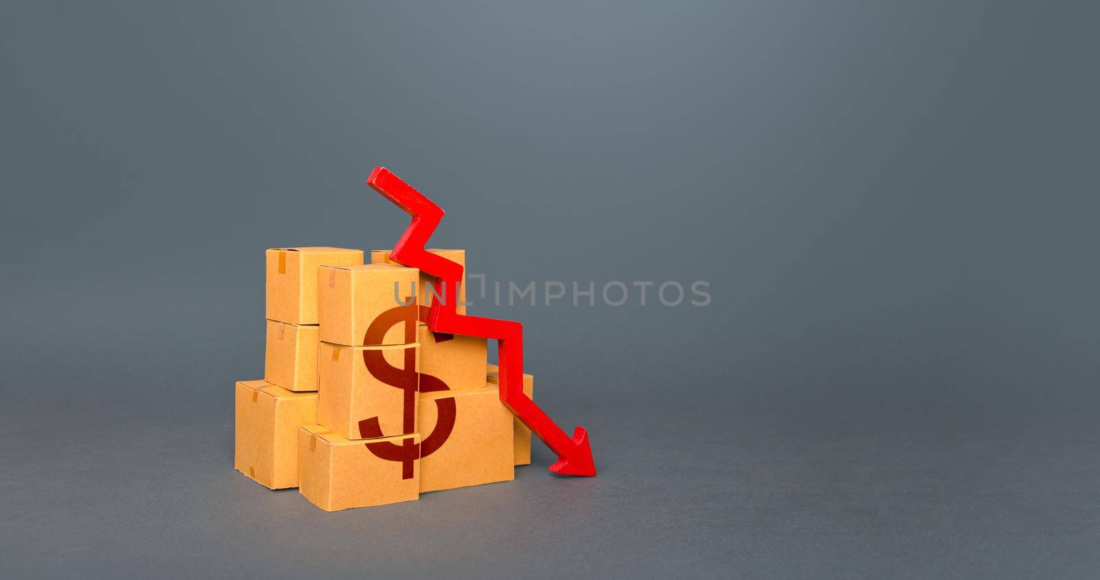 Boxes with dollar symbol and down arrow. Decrease in stocks of products. The fall in the production of goods. Worsening trade. Embargo, sanctions. Low consumption. Economic slowdown. Price reduction