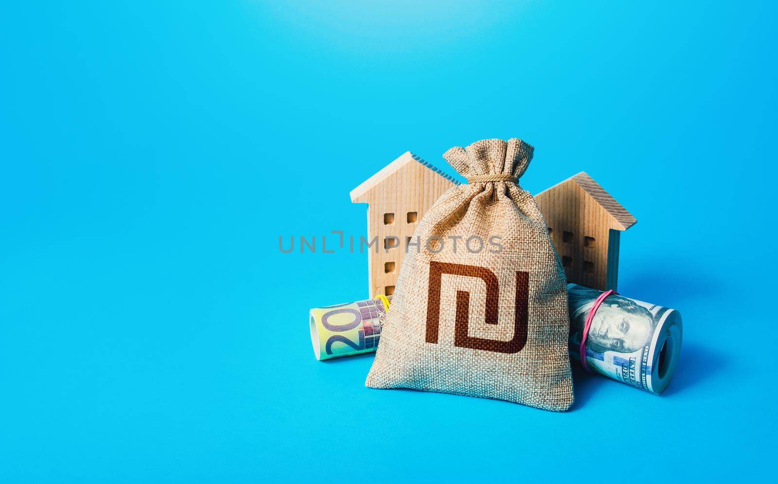 Houses and israeli shekel money bag. Building up capital, saving from inflation risks. Real estate. Savings. Declaration, taxes payment. Bookkeeping, accounting. Asset, financial resource management.