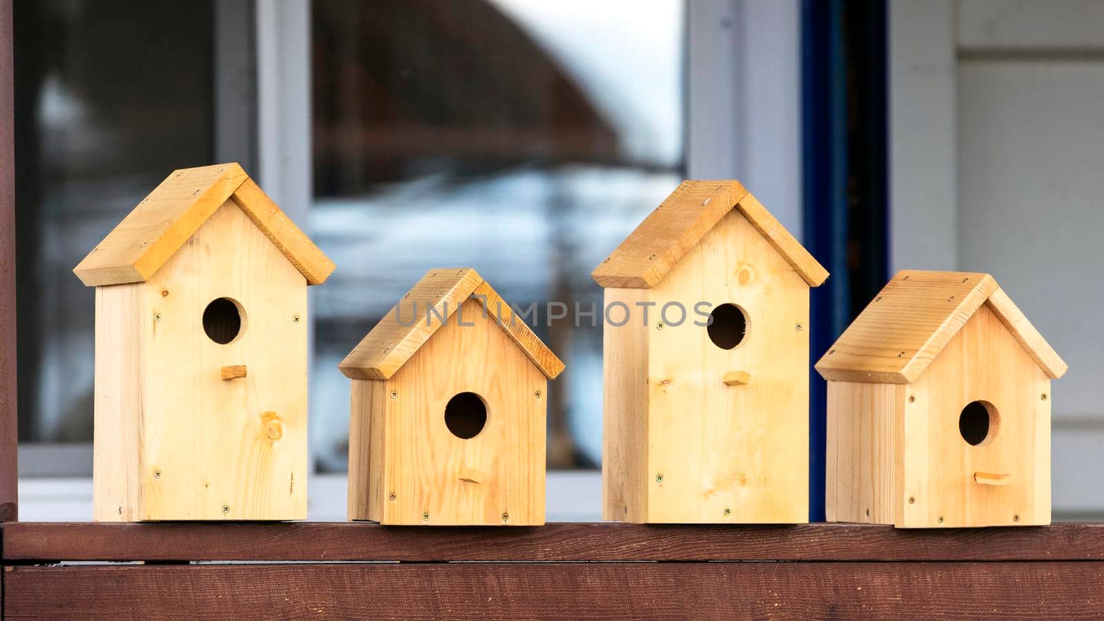 Four wooden birdhouses on sale by Nobilior