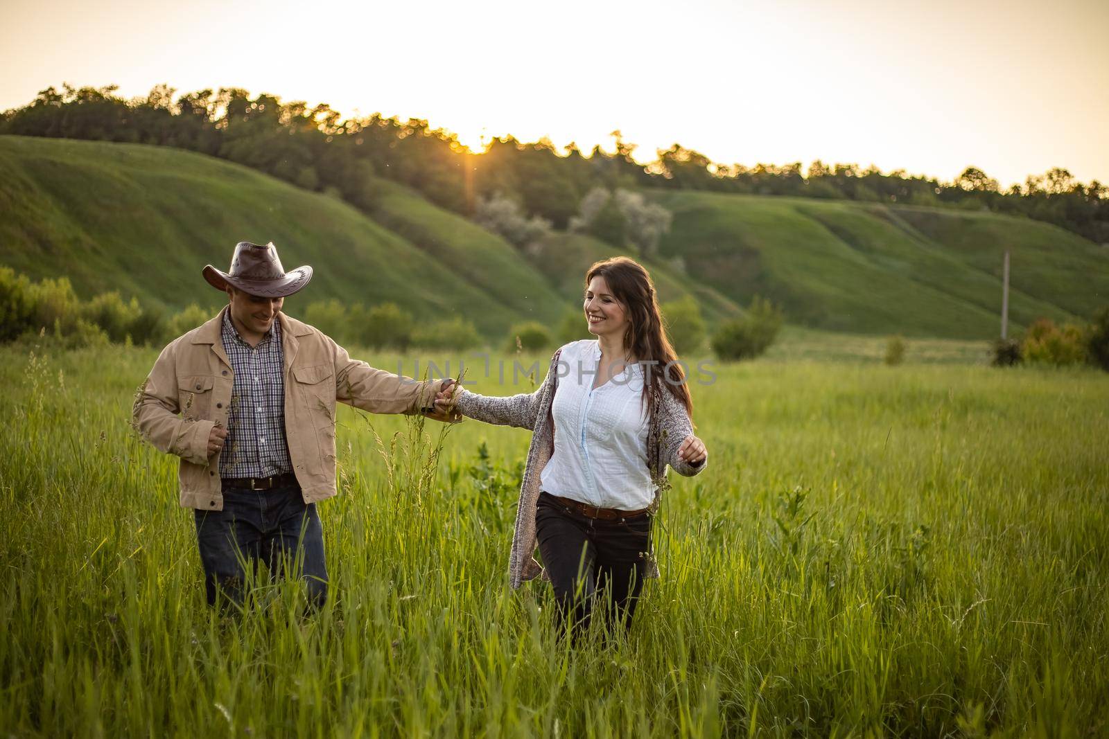 nice portrait of beautiful and young groom and bride outdoors