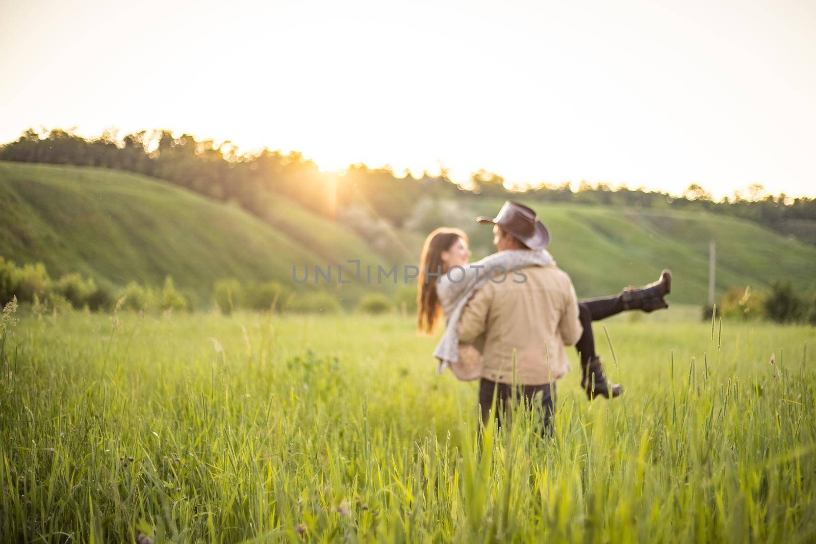 nice portrait of beautiful and young groom and bride outdoors