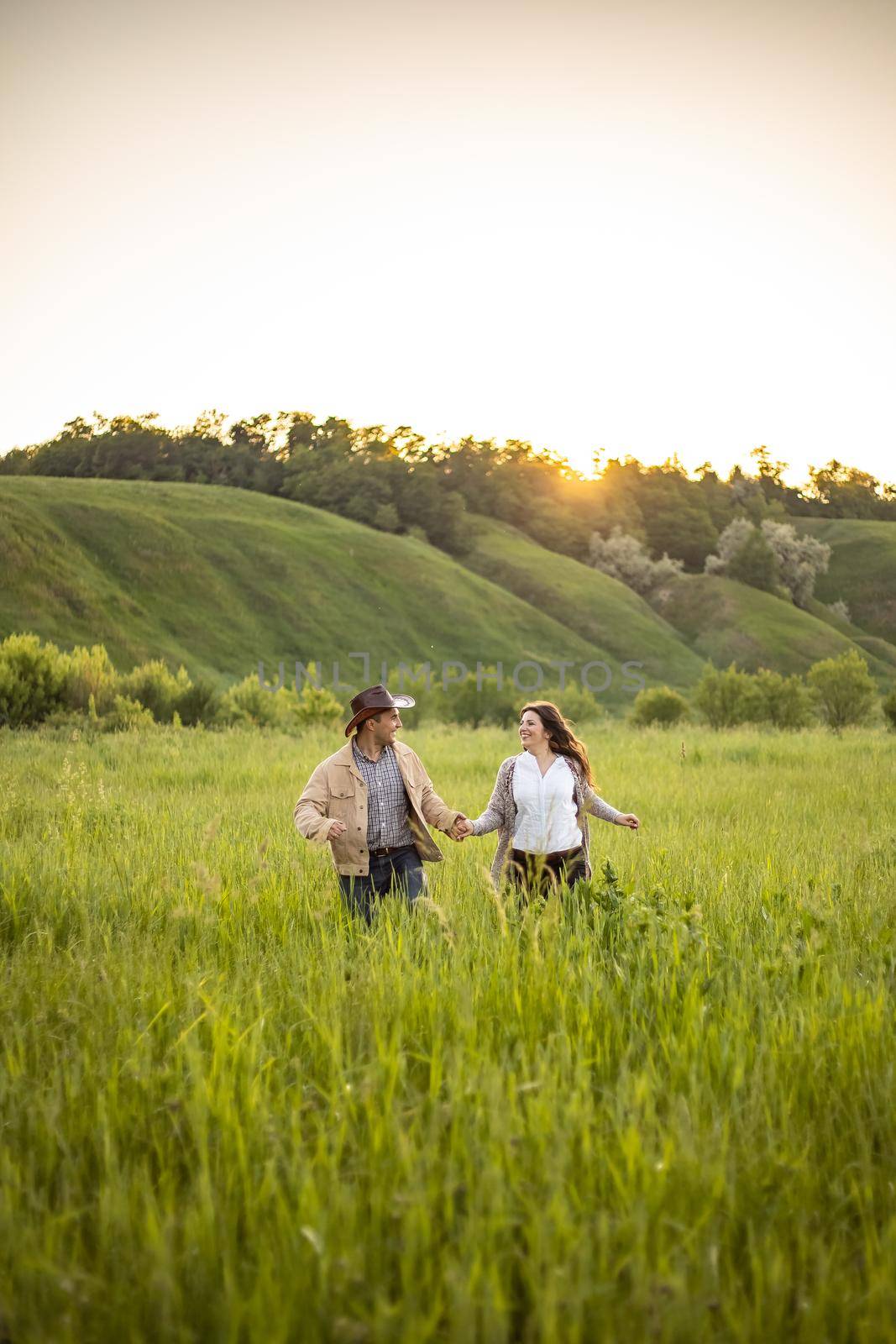 nice portrait of beautiful and young groom and bride outdoors