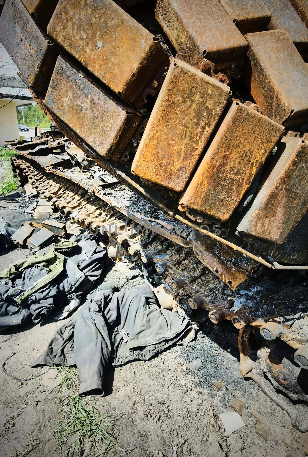 Kyiv region, Ukraine - May 15, 2022: War in Ukraine. Highway Kyiv - Zhytomyr. People take selfies against destroyed russian tank after russian atack in Febrary. by sarymsakov