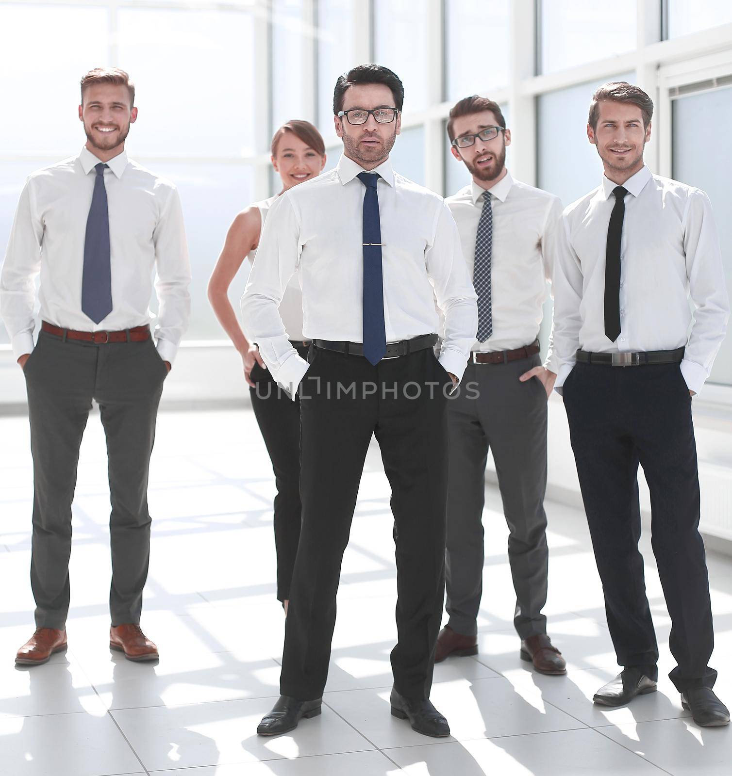 group of young employees standing in the office by asdf