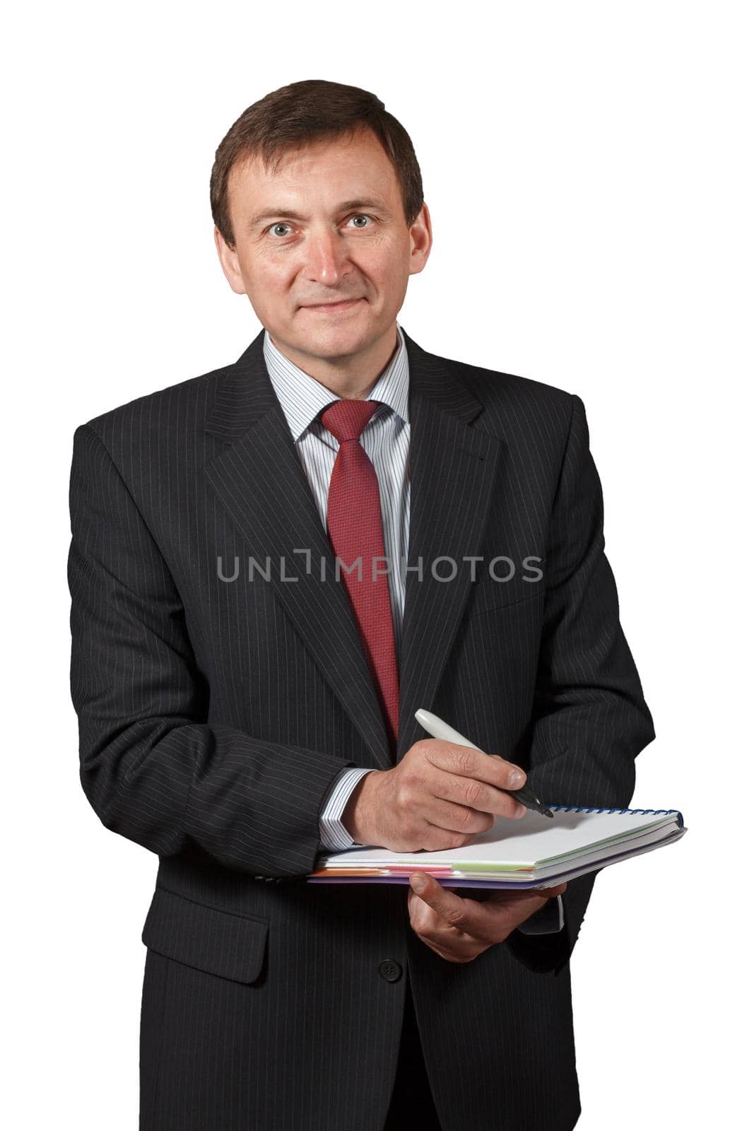 Confident and friendly elegant handsome mature businessman holding a marker and writing in a notebook on white isolated background