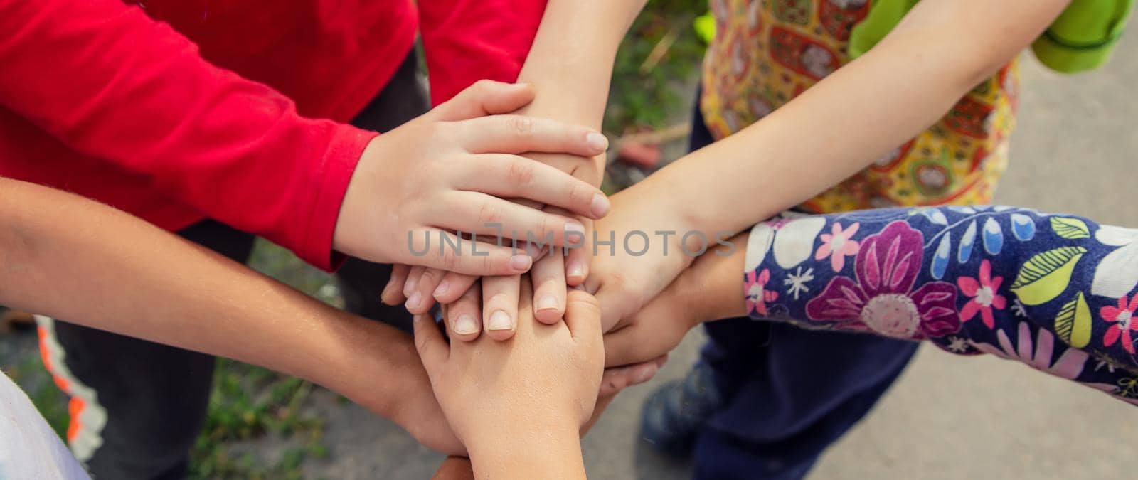 hands of children, many friends, games. Selective focus summer