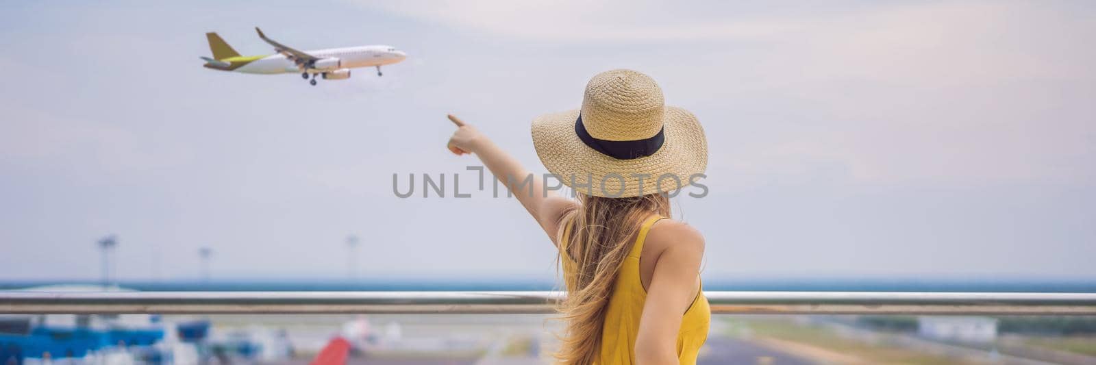 Start of her journey. Beautiful young woman ltraveler in a yellow dress and a yellow suitcase is waiting for her flight BANNER, LONG FORMAT by galitskaya