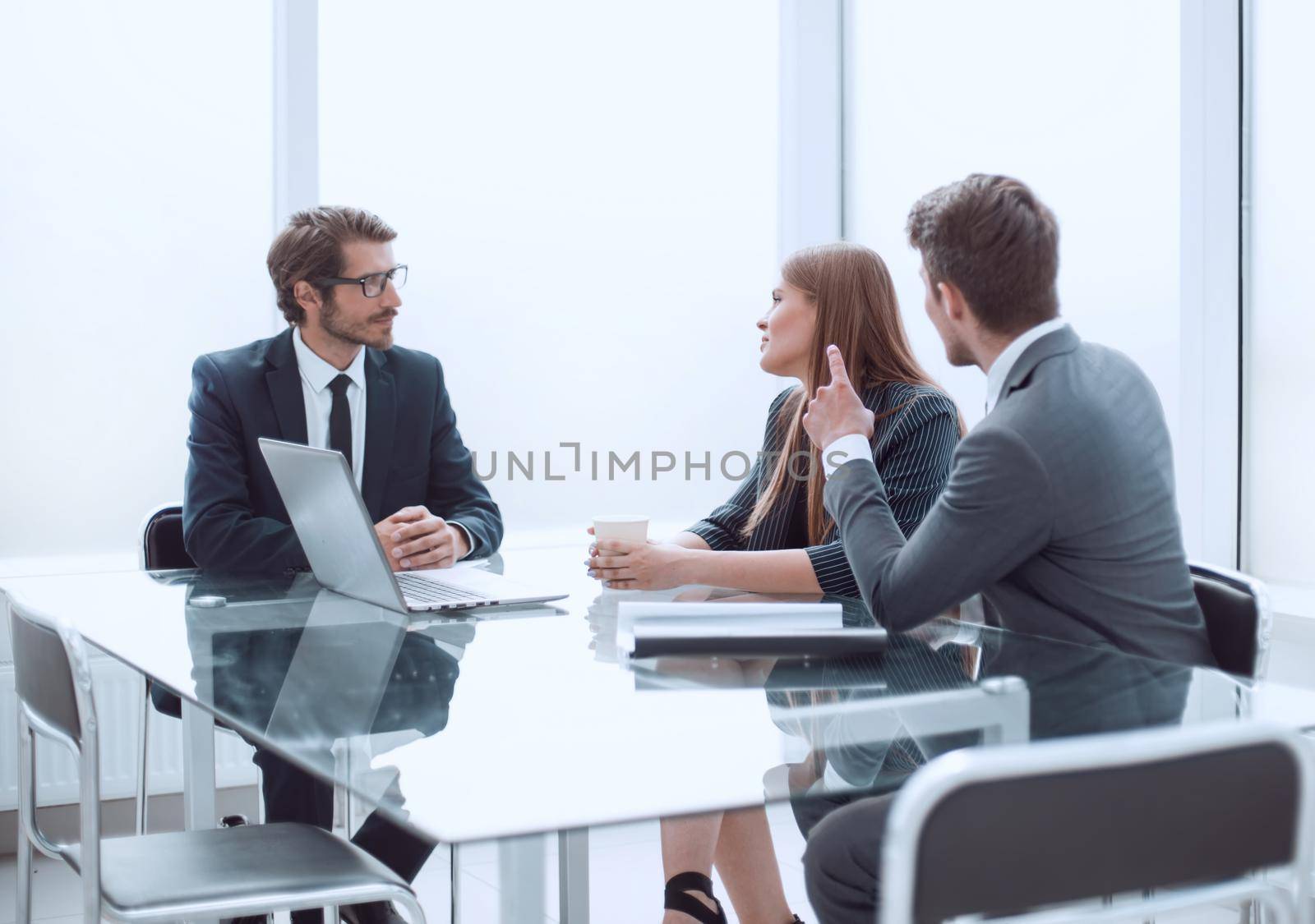 business people at a meeting in a modern office by asdf