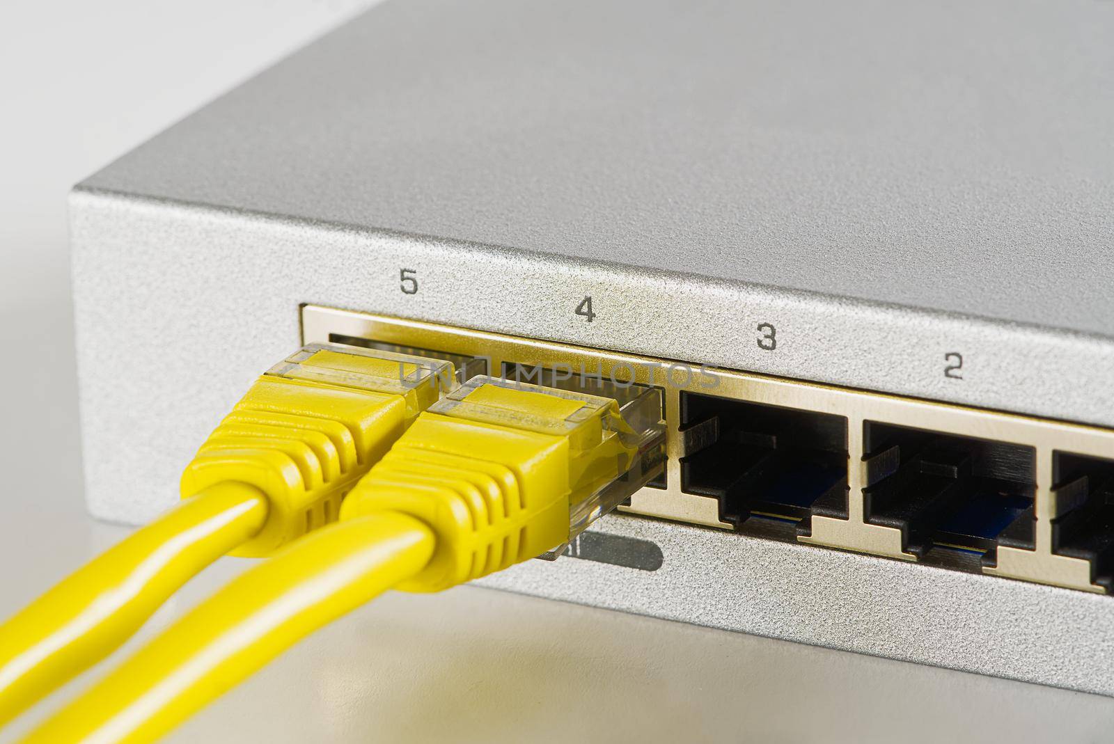 Small router and switch. tcp ip network business concept. High - performance gigabit switch. home network gray switch.